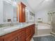Well-appointed bathroom with double vanity and a soaking tub at 2907 Willow Oak Ct, Kissimmee, FL 34744