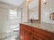 Bathroom with granite countertop and walk-in shower at 2907 Willow Oak Ct, Kissimmee, FL 34744