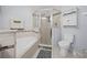 Clean bathroom featuring a shower, toilet, and bathtub at 2907 Willow Oak Ct, Kissimmee, FL 34744