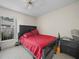 Bedroom with queen bed and window at 2907 Willow Oak Ct, Kissimmee, FL 34744
