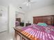 Charming bedroom with full-size bed and mirrored closet doors at 2907 Willow Oak Ct, Kissimmee, FL 34744