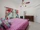 Comfortable bedroom with a king-size bed and access to patio at 2907 Willow Oak Ct, Kissimmee, FL 34744