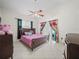 Spacious bedroom with king-size bed and plenty of natural light at 2907 Willow Oak Ct, Kissimmee, FL 34744