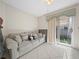 Bedroom with sofa and sliding glass doors at 2907 Willow Oak Ct, Kissimmee, FL 34744