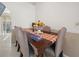 Bright dining room with a wood table and six chairs at 2907 Willow Oak Ct, Kissimmee, FL 34744