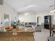Kitchen with granite countertops, offering views of the living room at 2907 Willow Oak Ct, Kissimmee, FL 34744