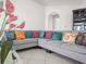 Living area featuring a sectional sofa with colorful pillows at 2907 Willow Oak Ct, Kissimmee, FL 34744