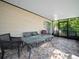 Cozy screened patio with seating area at 2907 Willow Oak Ct, Kissimmee, FL 34744