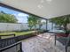 Relaxing screened patio overlooking a lush backyard at 2907 Willow Oak Ct, Kissimmee, FL 34744