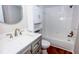 Bathroom with a white vanity, toilet, and tiled tub-shower combo at 948 Lake Destiny Rd # G, Altamonte Springs, FL 32714