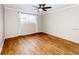 Inviting bedroom featuring hardwood floors and a large window at 948 Lake Destiny Rd # G, Altamonte Springs, FL 32714