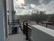 Balcony overlooking a tree-lined street and parking lot at 336 Center Lake Ln # A-2, Oviedo, FL 32765