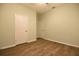 Spacious bedroom featuring wood-look floors and ample closet space at 1155 Merion Dr, Mount Dora, FL 32757