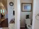 Small bathroom with toilet and decorative plants at 251 Rock Springs Dr, Poinciana, FL 34759