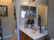 Clean bathroom with vanity, sink, and mirror at 251 Rock Springs Dr, Poinciana, FL 34759
