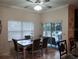 Bright breakfast nook with table and chairs, leading to a patio at 251 Rock Springs Dr, Poinciana, FL 34759
