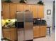 Kitchen features stainless steel refrigerator and microwave at 251 Rock Springs Dr, Poinciana, FL 34759