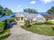 Luxury waterfront home with a metal roof and attached garage at 12943 Se Sunset Harbor Rd, Weirsdale, FL 32195
