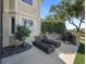 Private backyard oasis with lounge chairs and built-in grill at 12943 Se Sunset Harbor Rd, Weirsdale, FL 32195