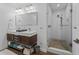 Spa-like bathroom with double vanity and a large shower at 12943 Se Sunset Harbor Rd, Weirsdale, FL 32195