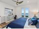 Serene bedroom with water views and dresser at 12943 Se Sunset Harbor Rd, Weirsdale, FL 32195