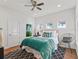 Bright bedroom with a queen-size bed and stylish decor at 12943 Se Sunset Harbor Rd, Weirsdale, FL 32195