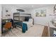 bedroom with bunk beds and a study area at 12943 Se Sunset Harbor Rd, Weirsdale, FL 32195