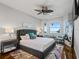 Main bedroom with a king-size bed, water views and stylish decor at 12943 Se Sunset Harbor Rd, Weirsdale, FL 32195