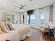 Spacious main bedroom with water view and comfortable seating area at 12943 Se Sunset Harbor Rd, Weirsdale, FL 32195