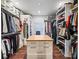 Large walk-in closet with ample shelving and hanging space at 12943 Se Sunset Harbor Rd, Weirsdale, FL 32195