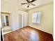 Bedroom features a ceiling fan, closet, and window for ample natural light at 510 Coventry Rd, Davenport, FL 33897