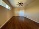 Relaxing bedroom with wood-look flooring and sliding glass doors at 510 Coventry Rd, Davenport, FL 33897