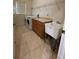 The laundry room features a washer, dryer, utility sink, and a folding counter at 510 Coventry Rd, Davenport, FL 33897