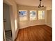 Bright dining area with hardwood floors and large windows at 2814 Coventry Ave, Lakeland, FL 33803