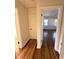 Hardwood floor hallway with access to bedrooms and bath at 2814 Coventry Ave, Lakeland, FL 33803