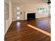 Hardwood floor living room with fireplace and built-ins at 2814 Coventry Ave, Lakeland, FL 33803