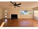 Living room with hardwood floors, fireplace, and large windows at 2814 Coventry Ave, Lakeland, FL 33803