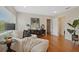 Bright living room with hardwood floors, a chaise lounge, and large windows at 2814 Coventry Ave, Lakeland, FL 33803