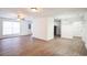 Living room with wood-look floors and big windows at 1316 Hackett St, Mount Dora, FL 32757