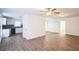 Open living room featuring wood-look flooring and a ceiling fan at 1316 Hackett St, Mount Dora, FL 32757