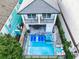 Luxury home with private pool and spa, surrounded by lush landscaping at 1544 Corolla Ct, Reunion, FL 34747