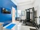 Home gym with various exercise equipment, including a stationary bike and weight machine at 1544 Corolla Ct, Reunion, FL 34747