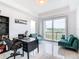 Home office with a desk, comfortable seating, and large window with golf course view at 1544 Corolla Ct, Reunion, FL 34747