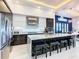 Modern kitchen with sleek cabinetry, marble countertops, and stainless steel appliances at 1544 Corolla Ct, Reunion, FL 34747