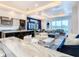 Modern kitchen with marble island, stainless steel appliances, and ample counter space at 1544 Corolla Ct, Reunion, FL 34747