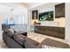 Media room with a large TV, wet bar, and comfortable seating area at 1544 Corolla Ct, Reunion, FL 34747