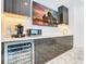Modern wet bar with wine cooler, microwave, and coffee maker at 1544 Corolla Ct, Reunion, FL 34747
