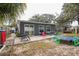 Backyard with patio, trampoline, and playset at 8115 Esperanza St, Orlando, FL 32817