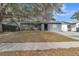 Ranch style home with mature landscaping and a large front yard at 8115 Esperanza St, Orlando, FL 32817