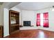 Brick fireplace with wooden mantel in living room at 8115 Esperanza St, Orlando, FL 32817